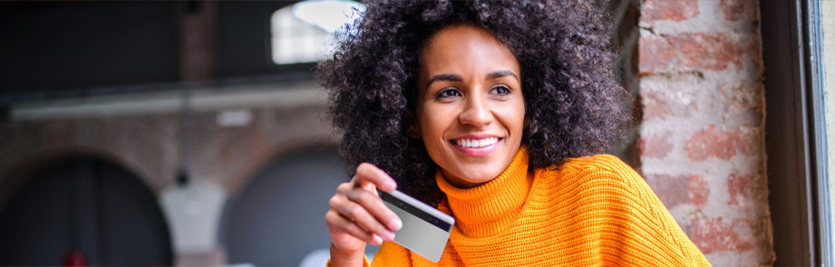 Woman holding a debit card